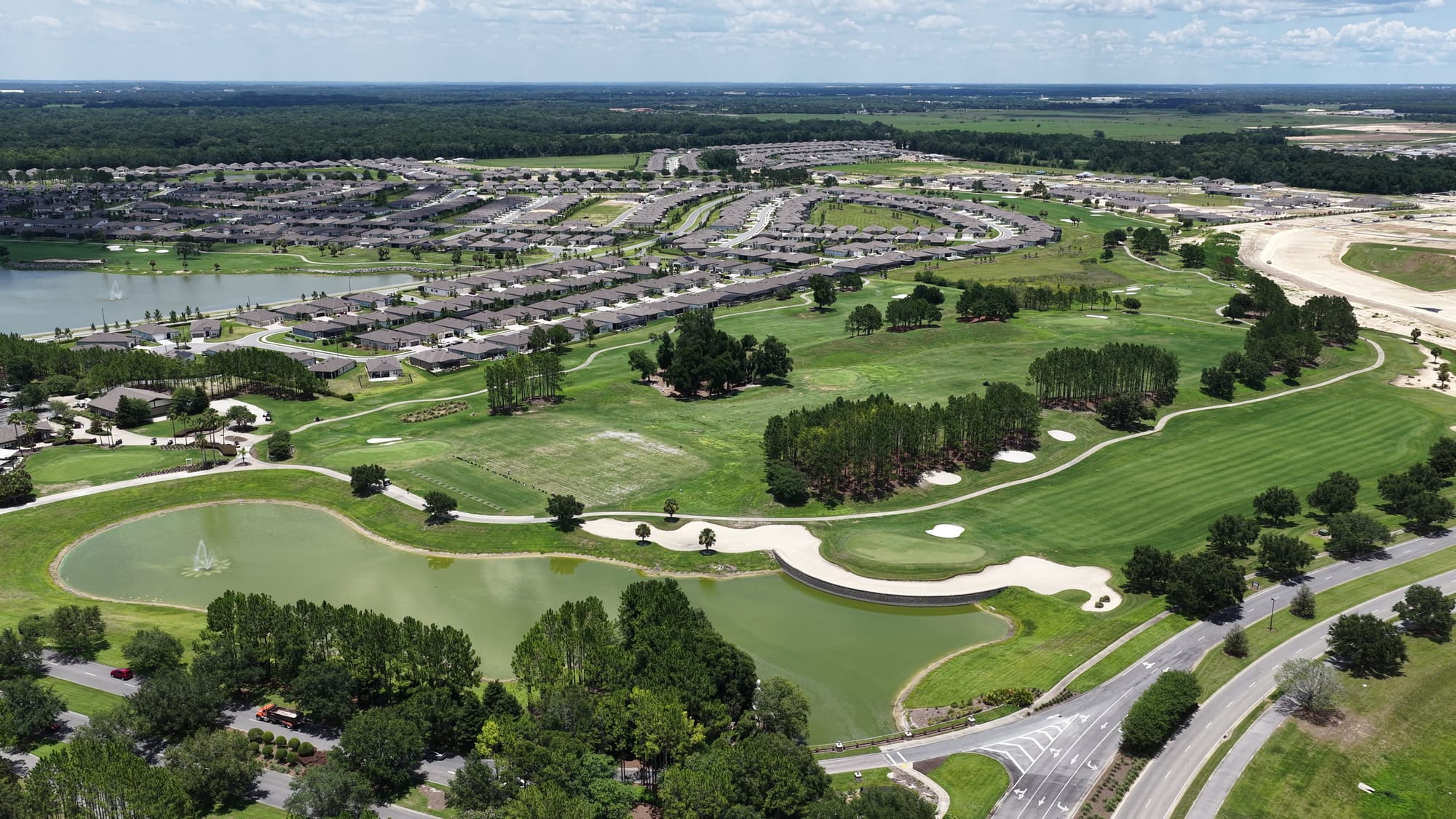 Del Webb Stone Creek golf - Aerial drone shot capturing an expansive golf cour